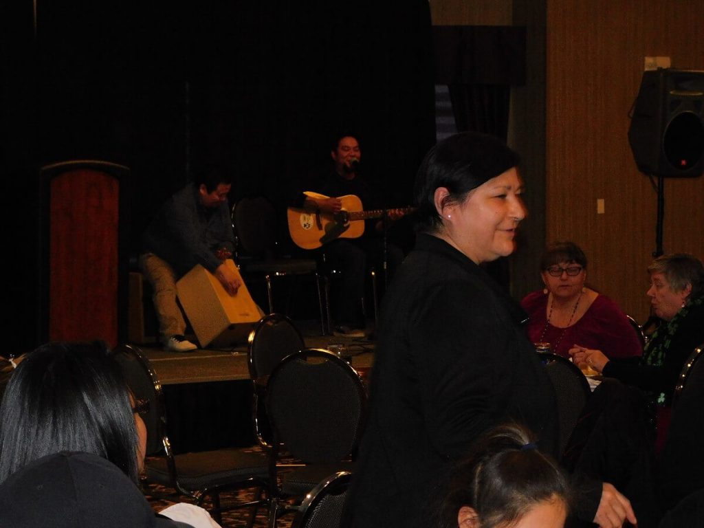 performers on stage- playing guitar