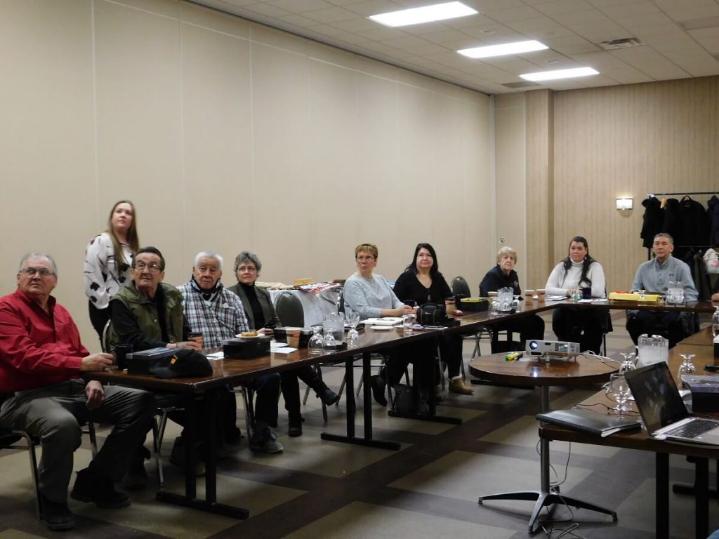 Elders and Staff sitting at L shaped table