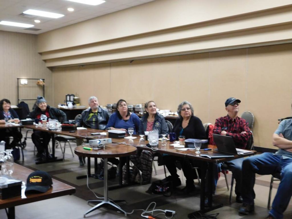 Elders and Staff sitting at L shaped table