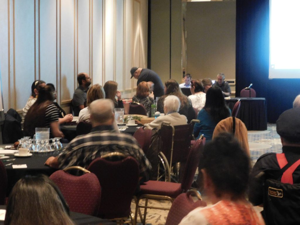 people at community meeting at tables
