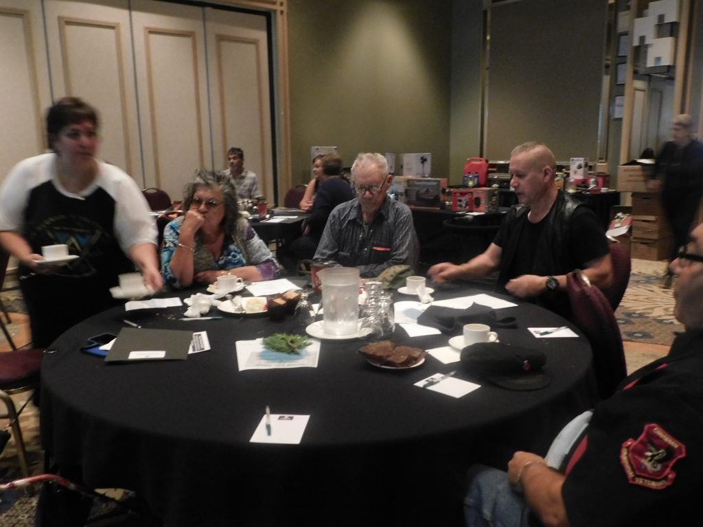 group of people sitting at a round table